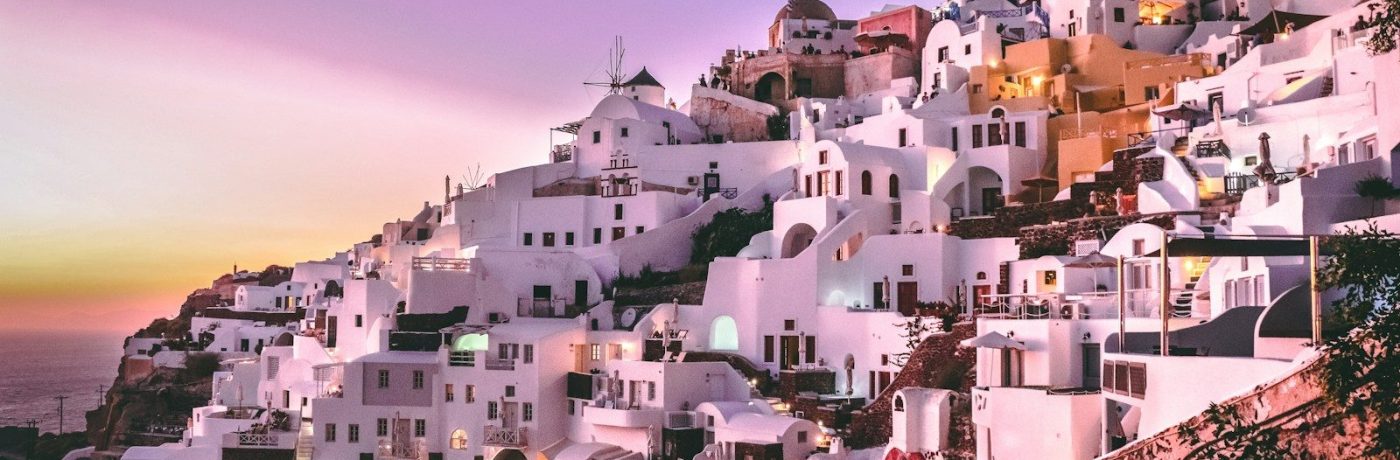 white concrete houses on hill during daytime